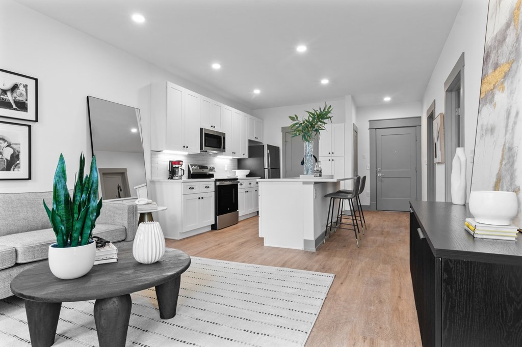 A modern kitchen with a dining area and a living room. at The Ridge Apartments, Ohio, 45213