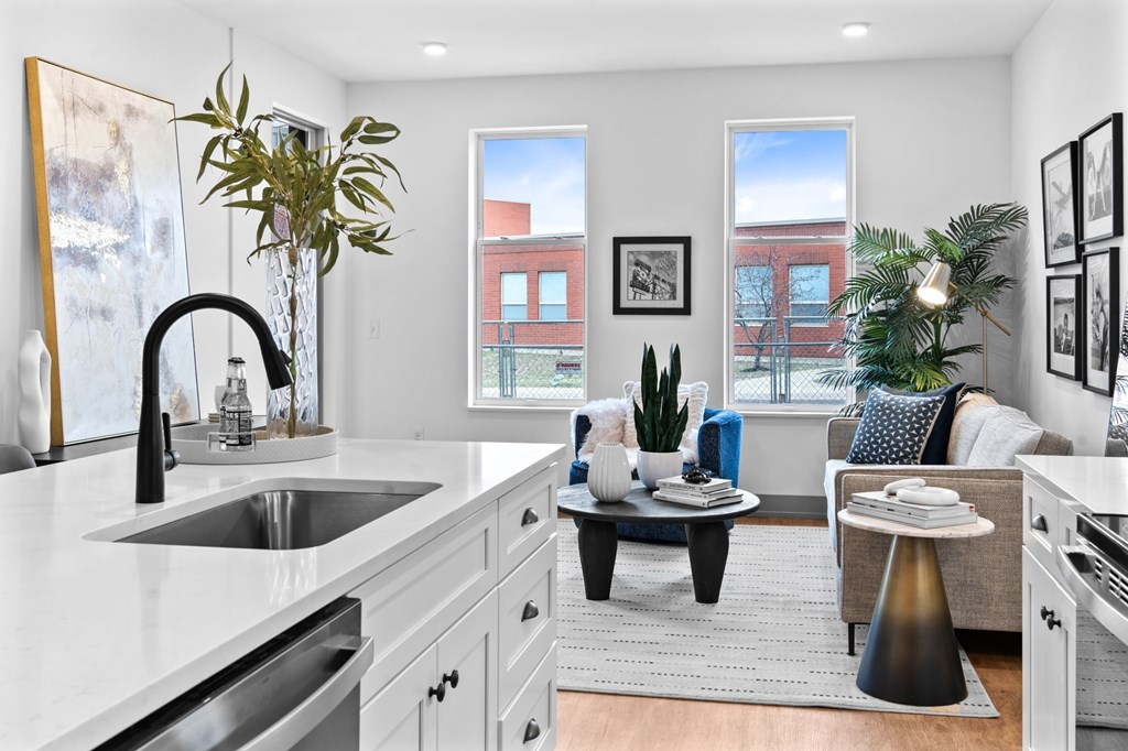 A modern kitchen with a large island and a dining area. at The Ridge Apartments, Ohio, 45213