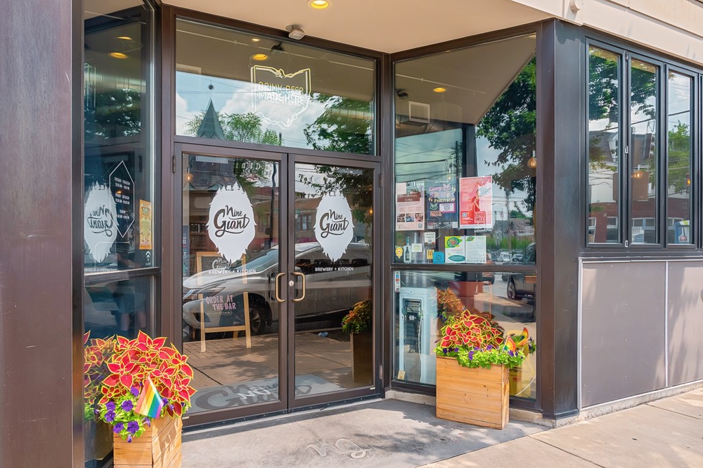 The storefront has a glass door at The Ridge Apartments, Cincinnati, OH
