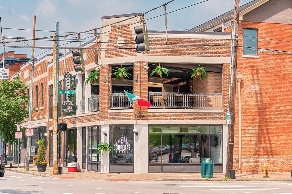 A street view of a building with a sign at The Ridge Apartments, Ohio