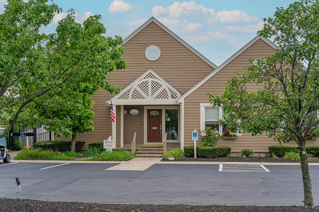 a large brown building with trees in front of it at Enclave, Beavercreek, Ohio