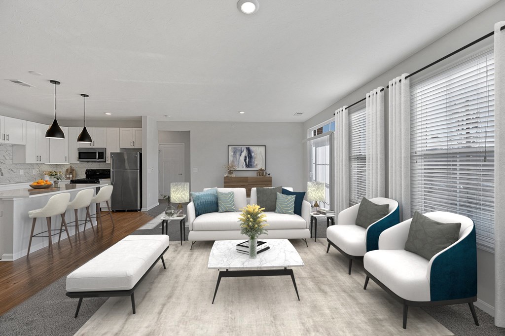 an open living room with a kitchen and dining area at Monmouth Row Apartments, Newport, KY, 41071