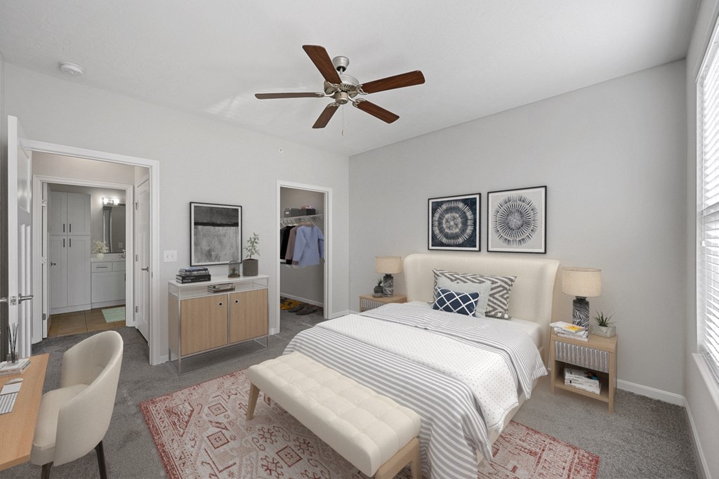 a bedroom with a bed and a ceiling fan at Monmouth Row Apartments, Newport, KY, 41071