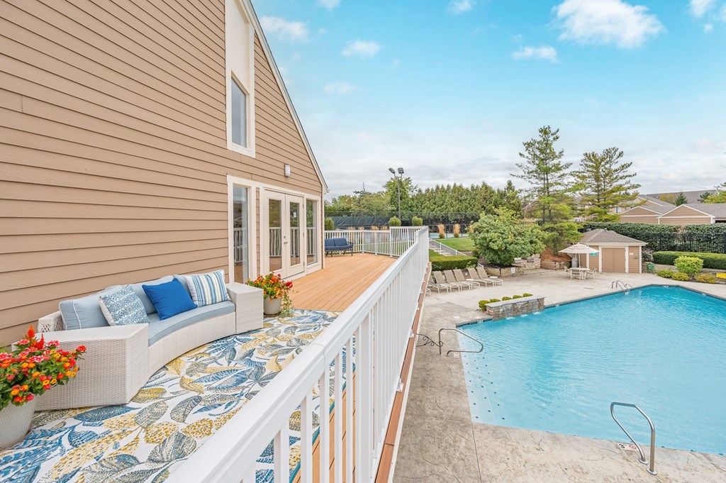 A house with a pool and a deck.
