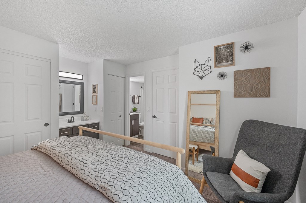 Bedroom with a bed and a chair  at Timber Glen Apartments, Ohio, 45103