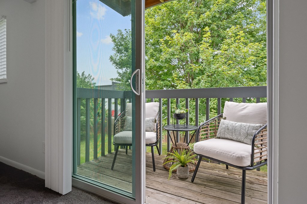 Balcony with two chairs and a table  at Timber Glen Apartments, Batavia, 45103