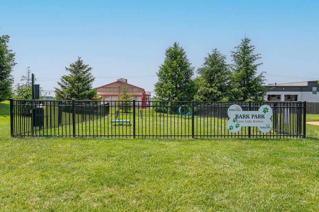 a park with a fence and a sign that reads park park