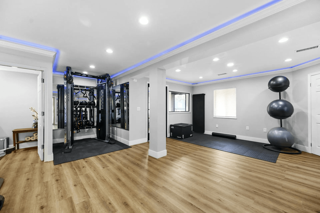Spacious Fitness center with wooden floor at Trails at Mariemont, Cincinnati