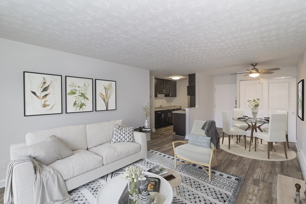 a living room and dining room with a couch and a table