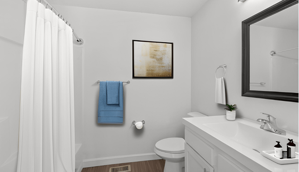 a bathroom with a shower and a sink and a toilet