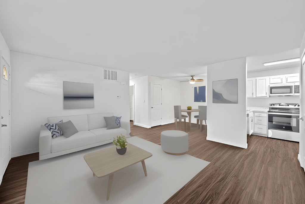 a living room with a white couch and a coffee table