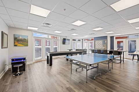 a game room with ping pong tables and a foosball