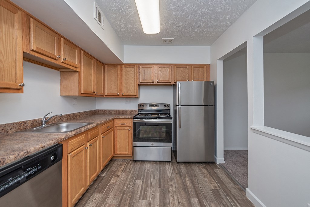 Kitchen With Custom Cabinetry at Millcroft Apartments and Townhomes, Milford, OH