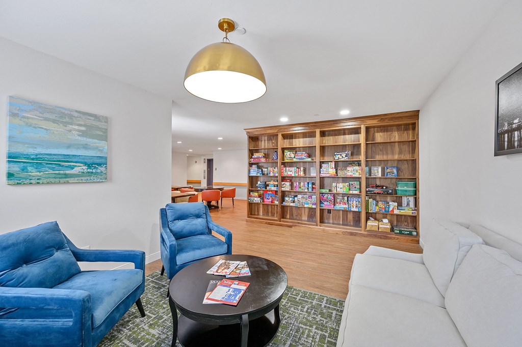 Living room filled with furniture and a large book shelf  at The Valley, Cincinnati, Ohio