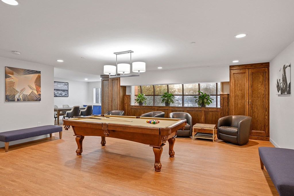 Game room with a pool table and chairs at The Valley, Cincinnati, Ohio
