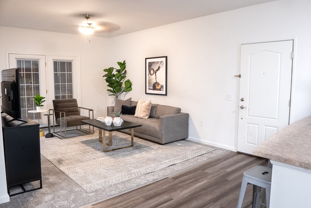 a living room with a couch coffee table and a tv  at Waterstone Landing, Perrysburg, 43551