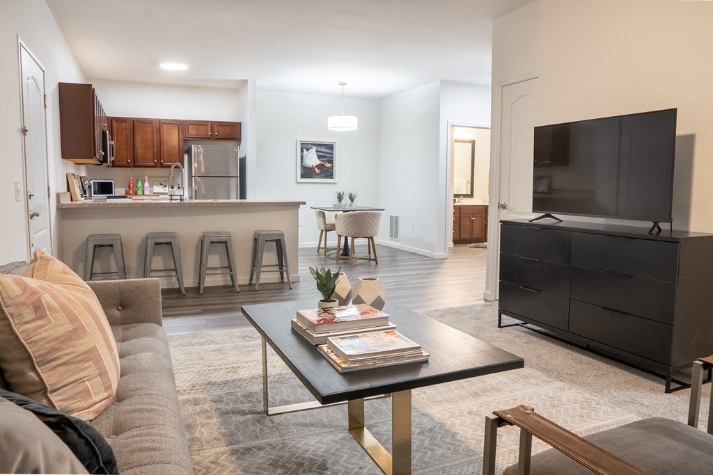 a living room with a couch a coffee table and a tv  at Waterstone Landing, Perrysburg, Ohio