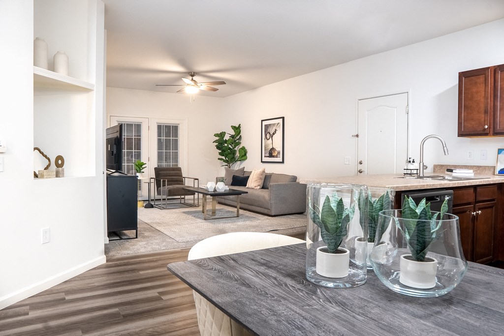 a living room and kitchen area with white walls and wood flooring at Waterstone Landing, Ohio, 43551