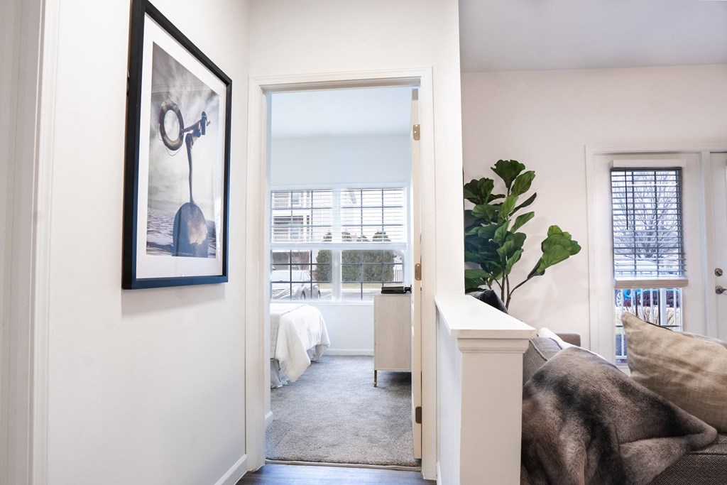 a bedroom with a large window and a door that leads to a bathroom  at Waterstone Landing, Ohio, 43551
