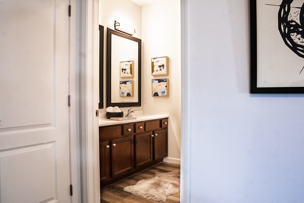 a bathroom with a sink and mirror in a 555 waverly unit at Waterstone Landing, Perrysburg, OH, 43551