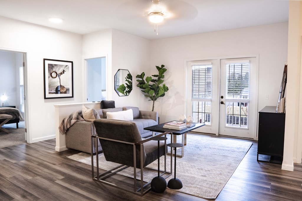 a living room with white walls and hardwood flooring  at Waterstone Landing, Ohio