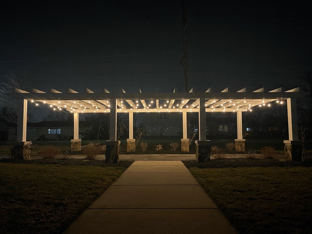 a pergola with string lights at night  at Waterstone Landing, Ohio, 43551