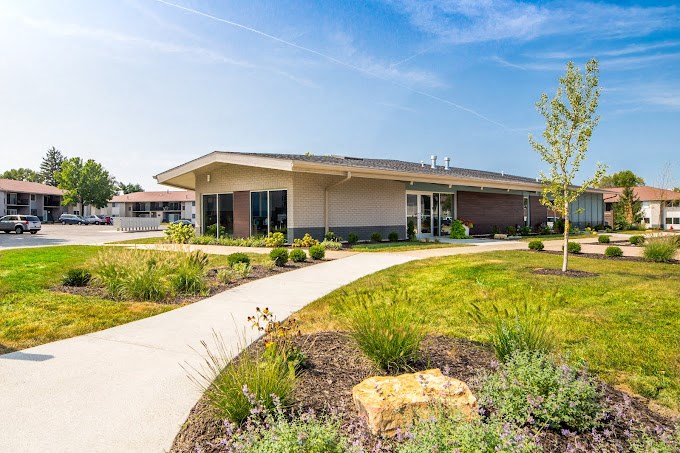 a building with a sidewalk in front of it