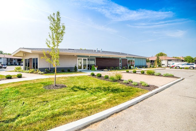 a building with a tree in front of it