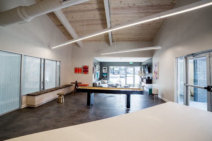 a games room with a ping pong table