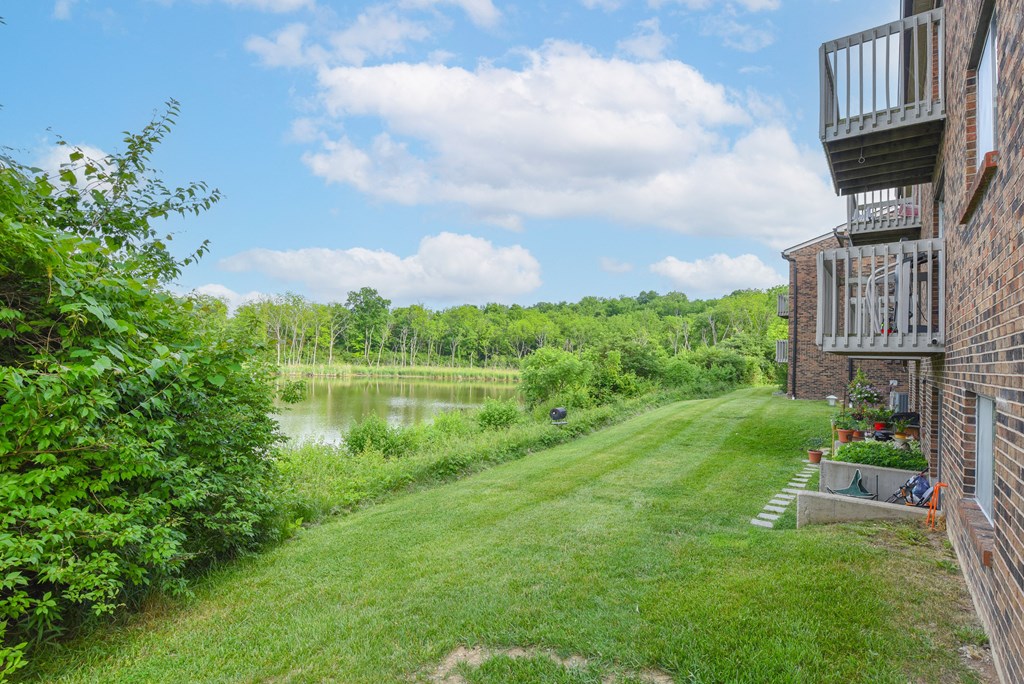 the view from the back yard of a house overlooking a lake at The Woodridge Collection, Fairfield