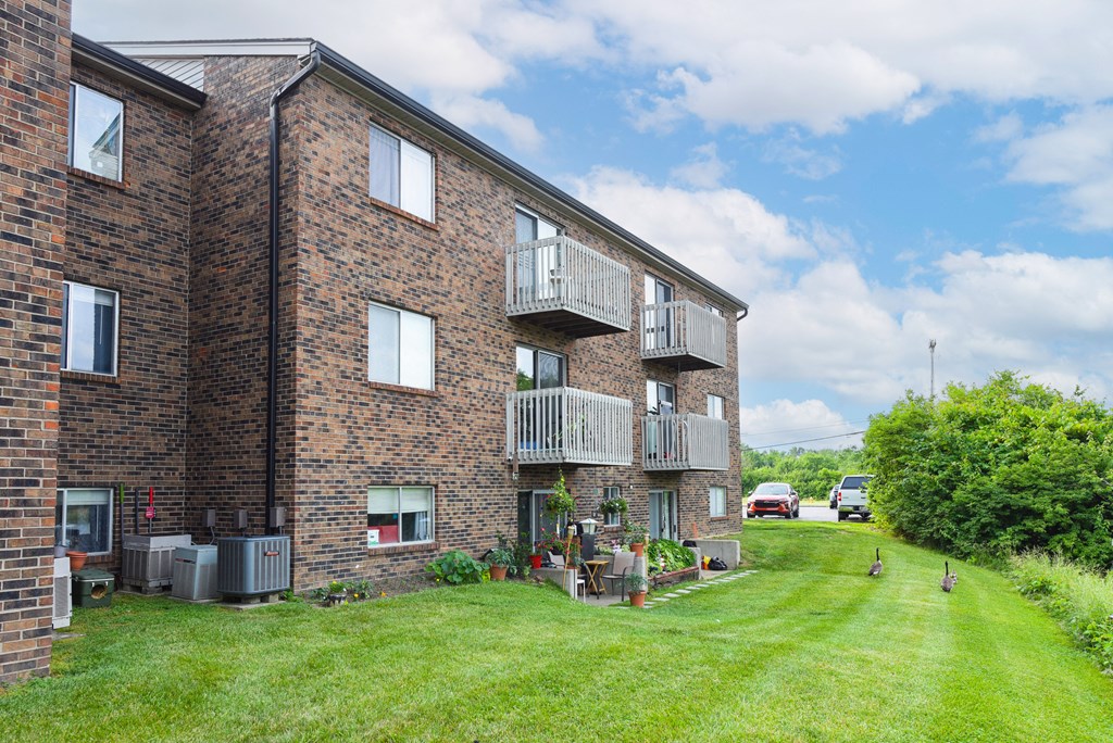 an illustration of a building with a field of grass at The Woodridge Collection, Ohio