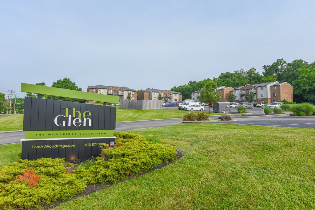 a sign for the glen at the entrance to a subdivision with houses at The Woodridge Collection, Ohio