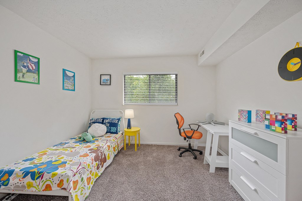 a bedroom with a bed and a desk at The Woodridge Collection, Fairfield