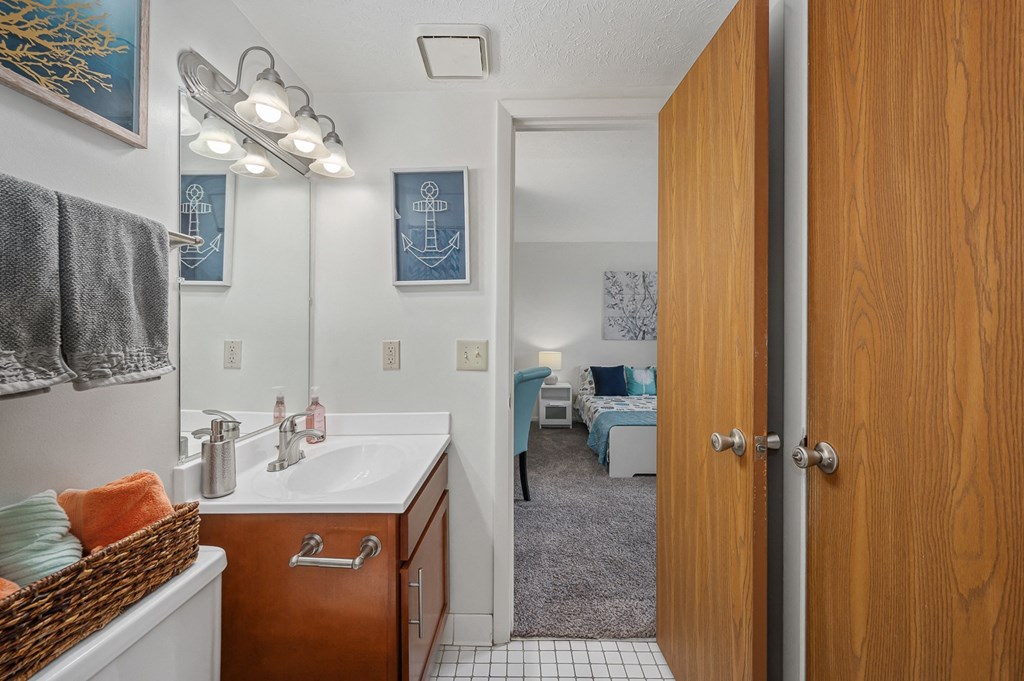 a bathroom with a sink and a mirror at The Woodridge Collection, Fairfield, 45014