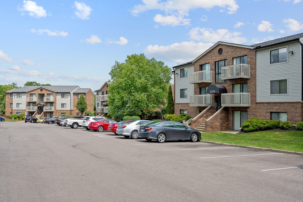 a parking lot at the whispering winds apartments in pearland, tx at The Woodridge Collection, Fairfield, 45014