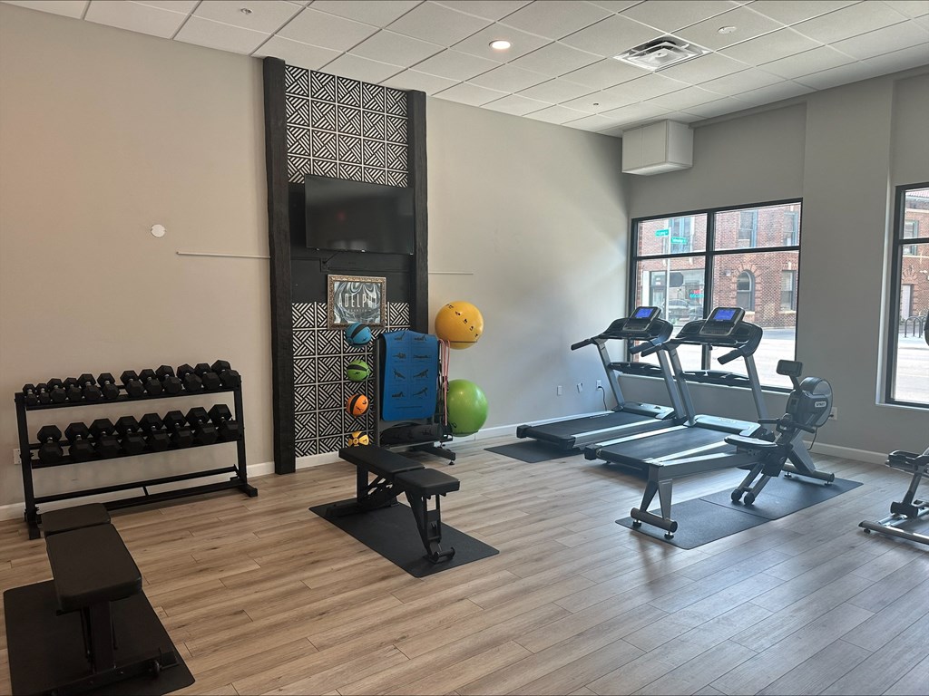 a fitness center with treadmills and other exercise equipment in a building at Adelphi Quarter, Columbus, 43203