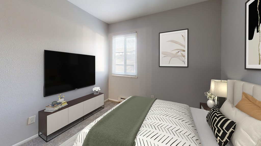 A modern bedroom with a large bed and a flat screen TV.