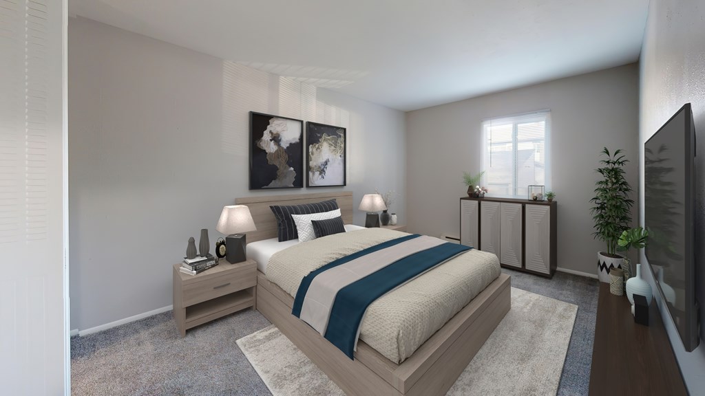 A modern bedroom with a large bed and a television.