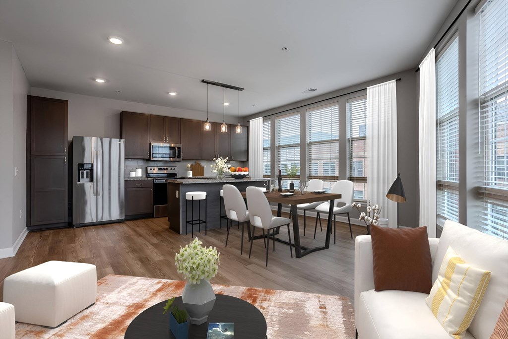 a living room and kitchen with a table and chairs at Adelphi Quarter, Columbus, Ohio