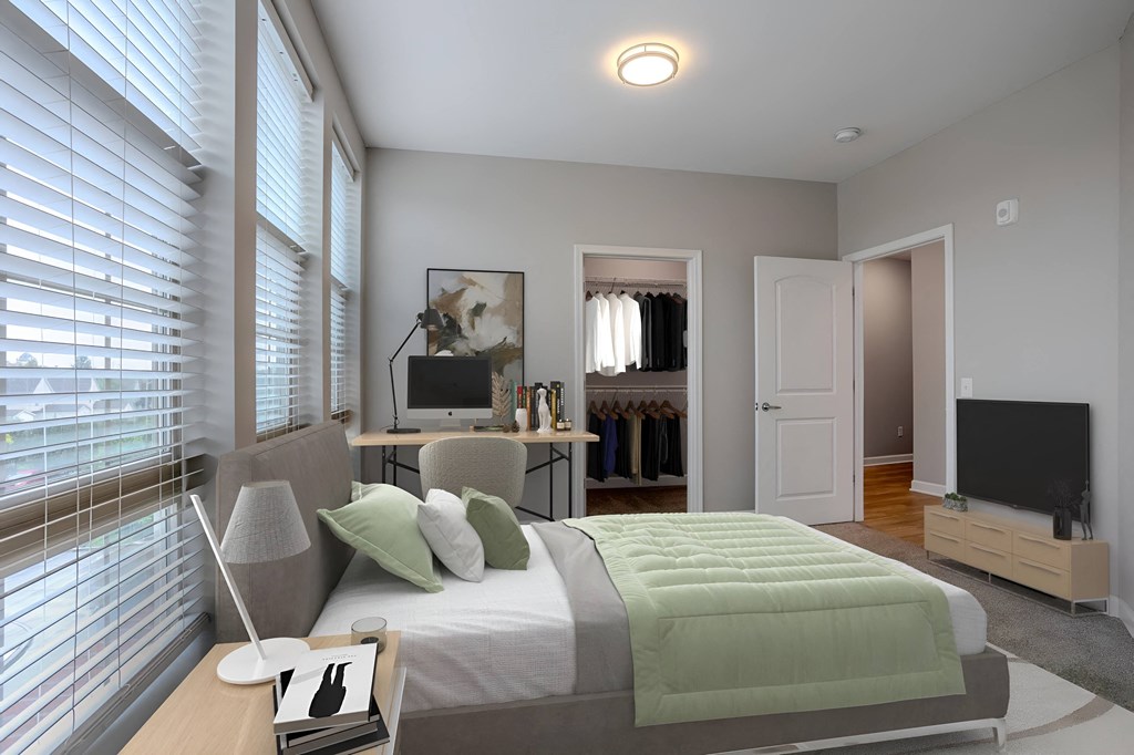 a bedroom with a bed and a desk with a tv at Adelphi Quarter, Columbus, Ohio