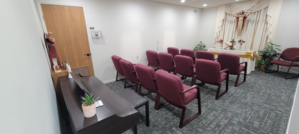 a room with chairs and a table in a church