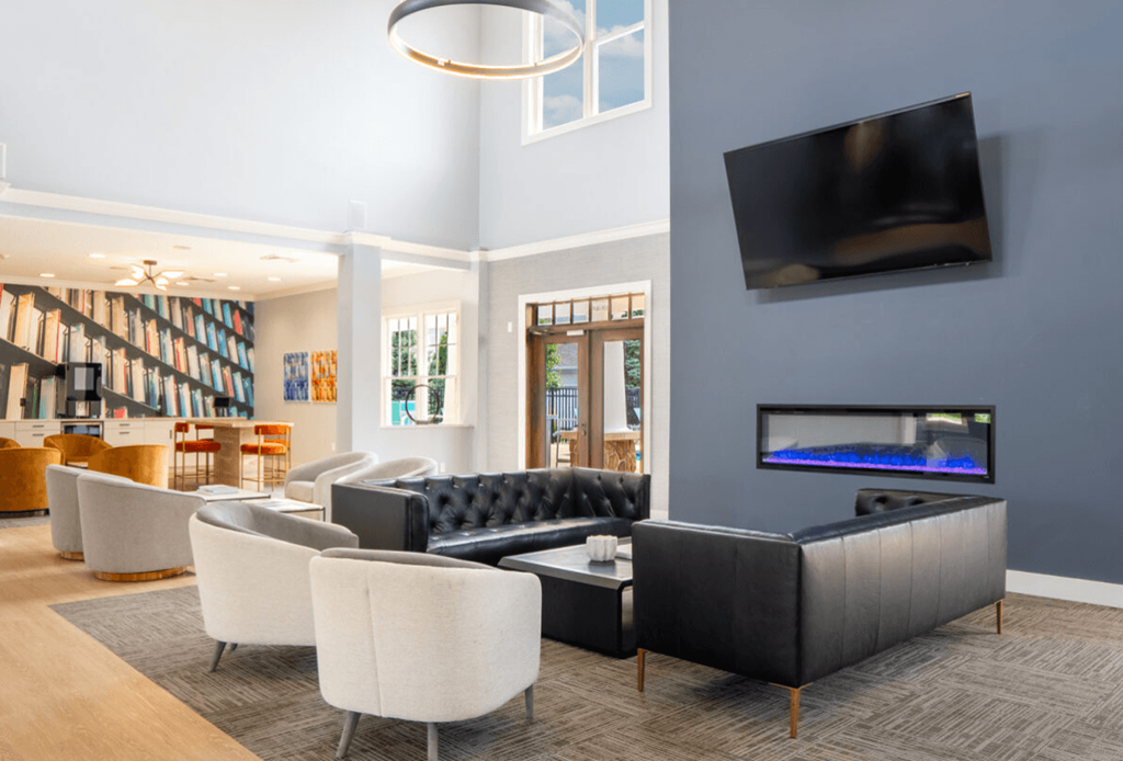 Living room with couches and chairs and a television