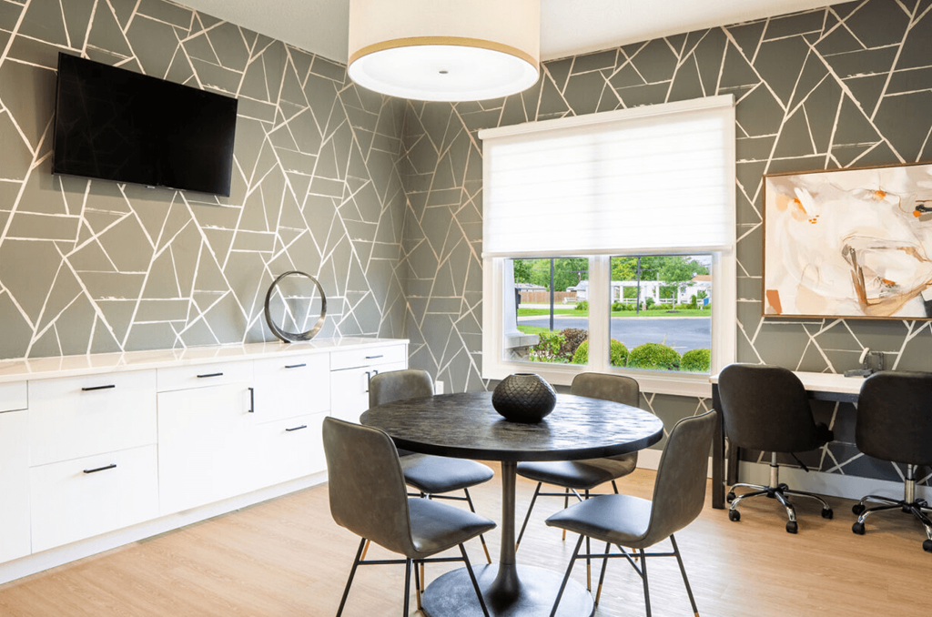 Dining room with a table and chairs and a window