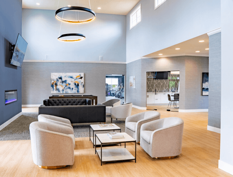 Living room with couches and chairs and a fireplace