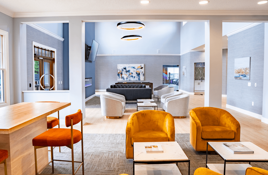 Living room with chairs and tables and a couch