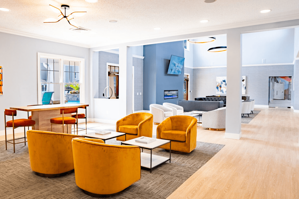 Living room with yellow chairs and a table