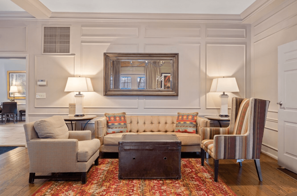 Living room filled with furniture and a mirror at Indian Creek Apartments, Cincinnati, OH, 45236