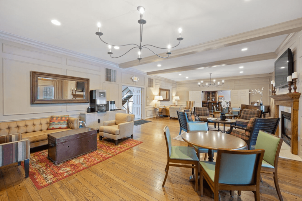 Clubhouse filled with furniture and a dining table at Indian Creek Apartments, 45236