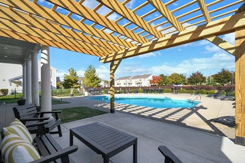Wooden pergola near pool at College Park, Ohio