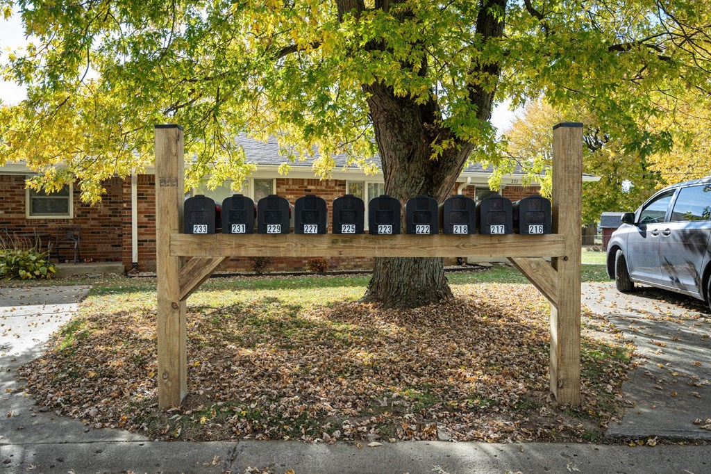 a mailbox post in front of a tree at Stonebrook of Franklin, Franklin, 46131